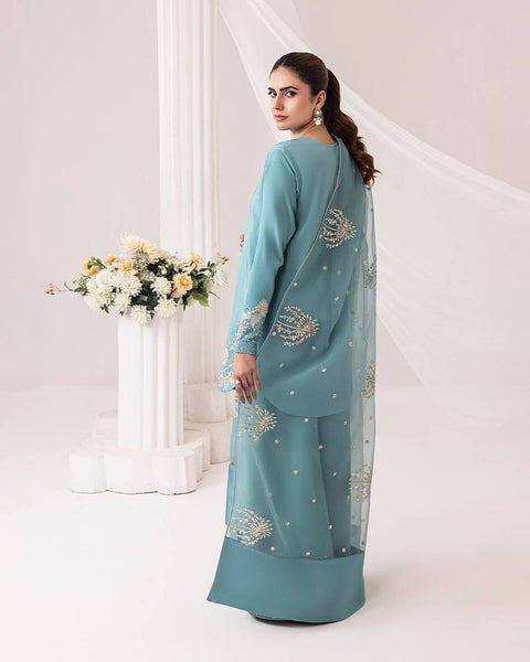 Teal Elegance: Embellished Suit with Sheer Dupatta and Graceful Traditional Charm