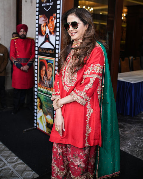 Radiant Red Embroidered Festive Outfit with Gold Detailing and Jewelry