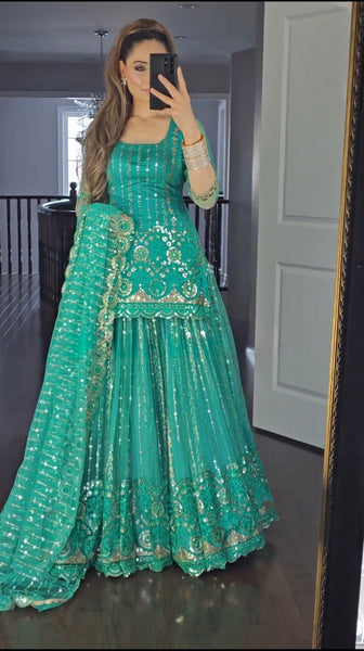 Regal Allure Lavish Green Embroidered Lehenga Choli for Celebrations